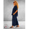 Frenzi Broekpak Jeanslook/Krantenprint